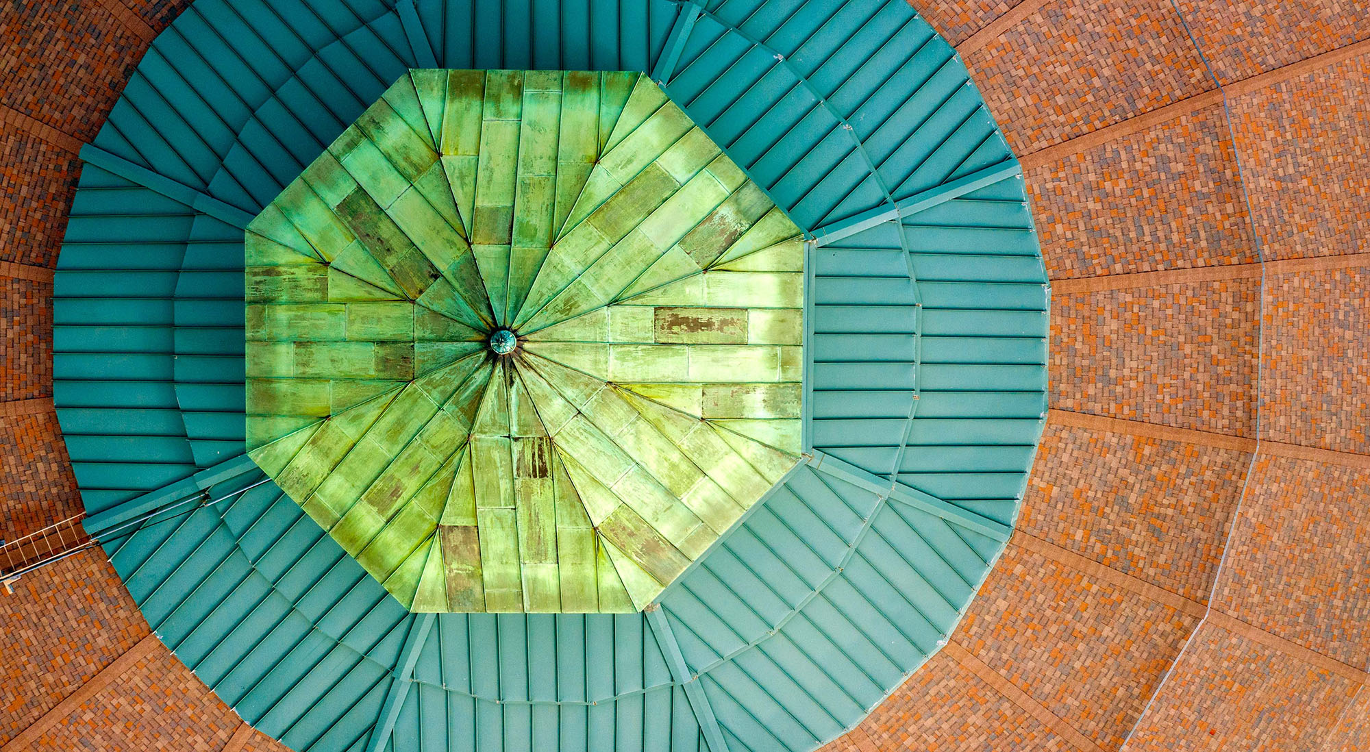 Orange colored roof with teal and green accents.