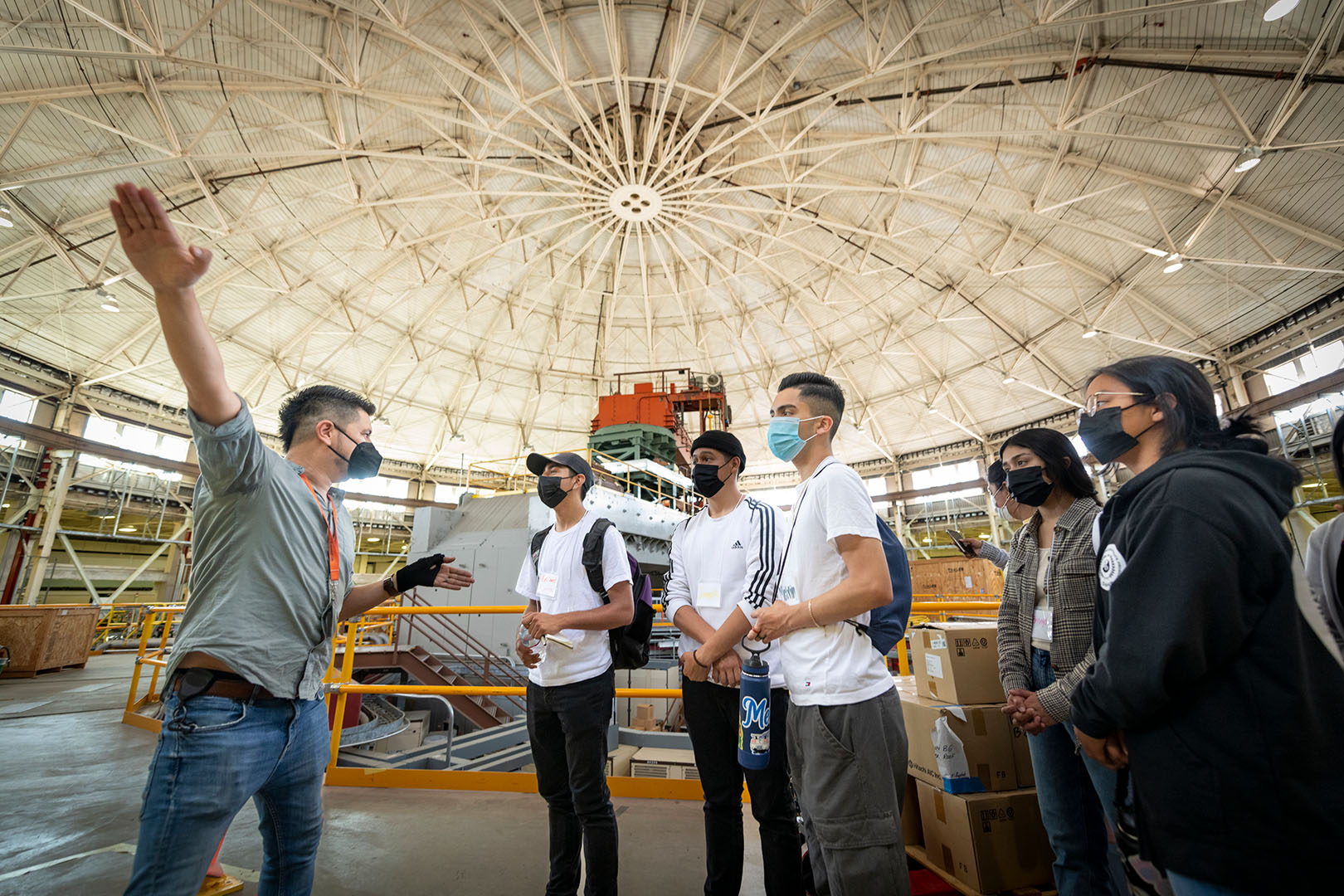 Students tour the Advanced Light Source dome with a guide.