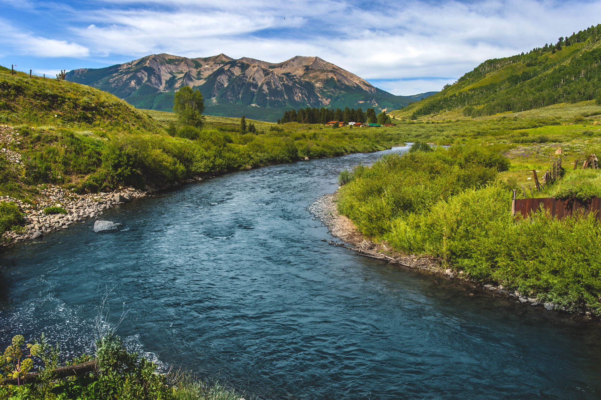 Green mountains and river in the East River catchment in Crested Butte Colorado.