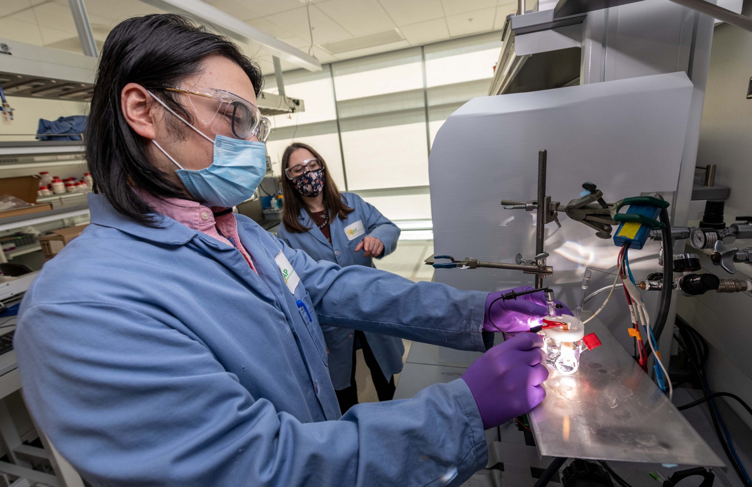 Scientist working at a lab benchtop.