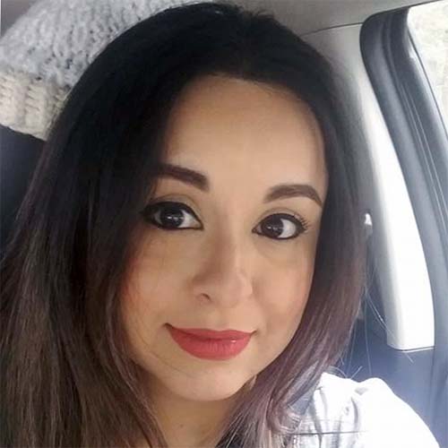 Person with dark, long hair.