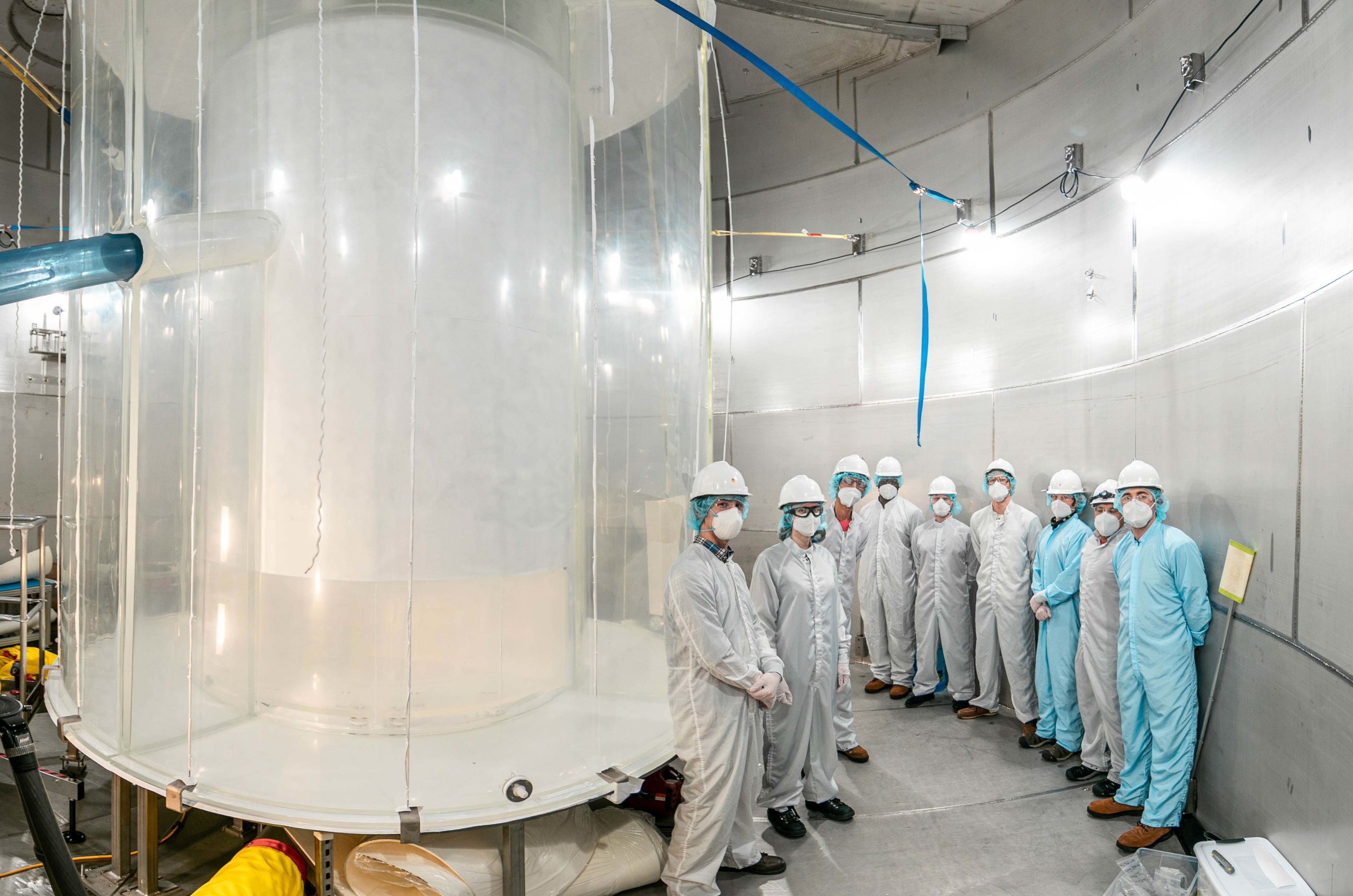 Members of the LZ team in the LZ water tank after the outer detector installation.