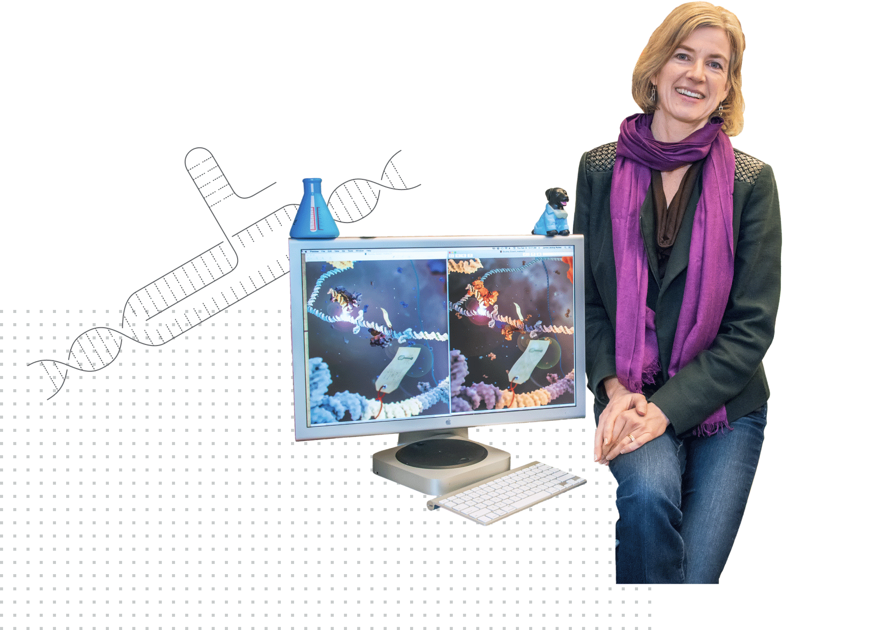 Jennifer Doudna, a blonde-haired person wearing a dark blouse and purple scarf, seated next to a computer showing a scientific model.