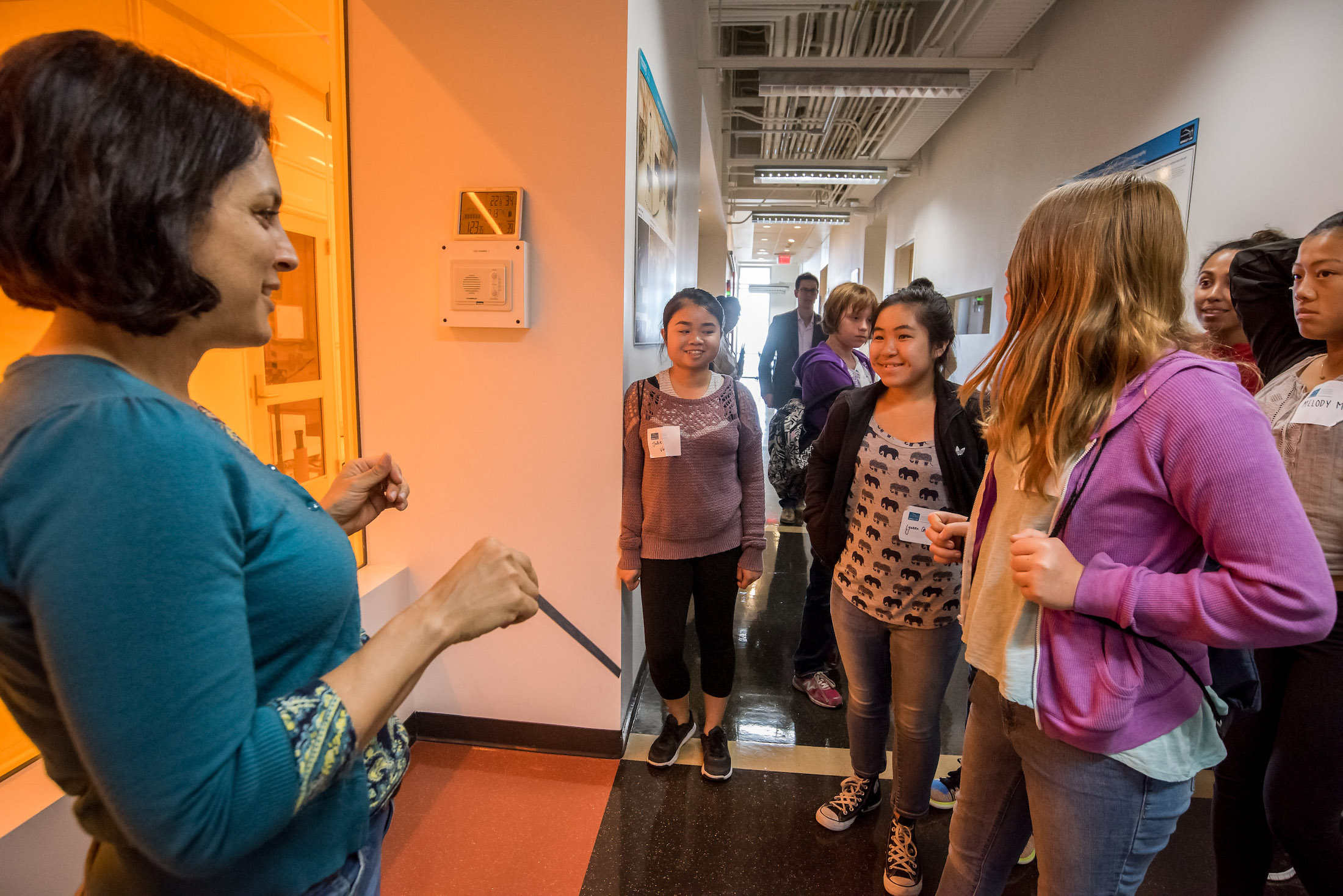 Person guides a group of girls for Women in STEM with Girls Inc.