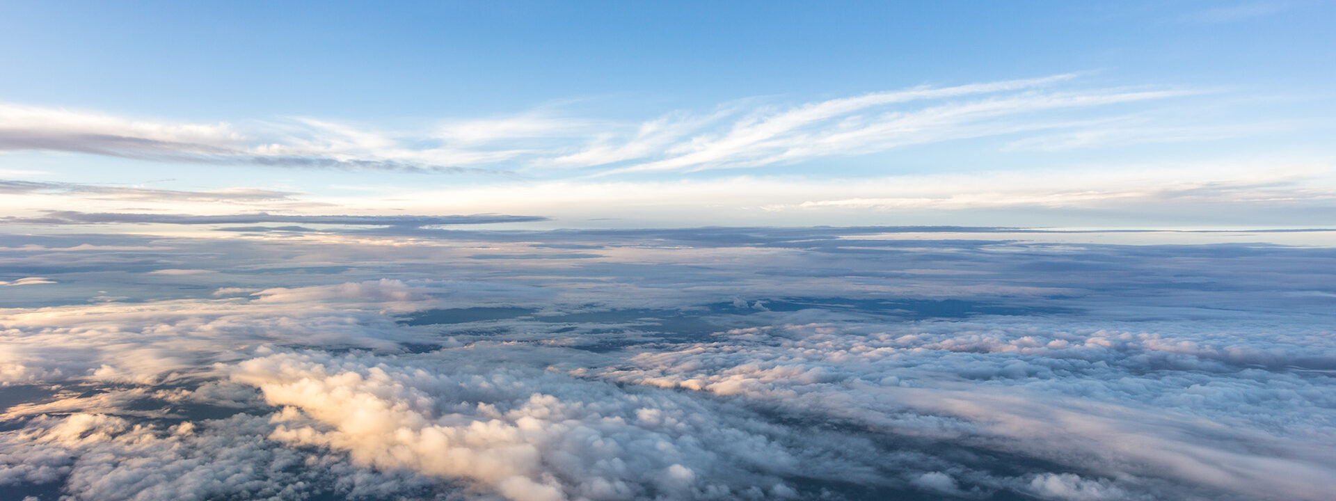 View of the blue sky from above the clouds.