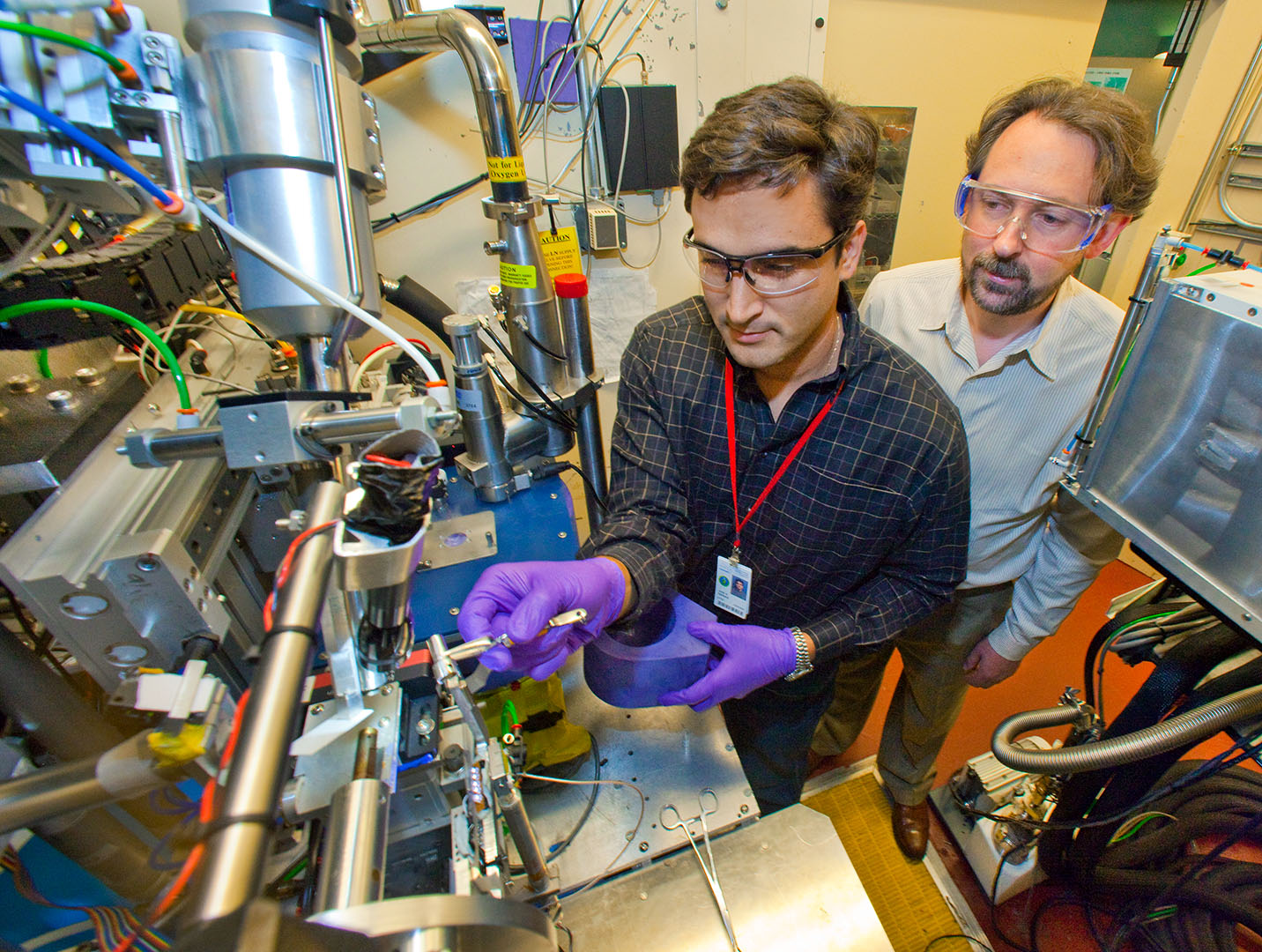 Paul Adams and Henrique Pereira work at the lab.