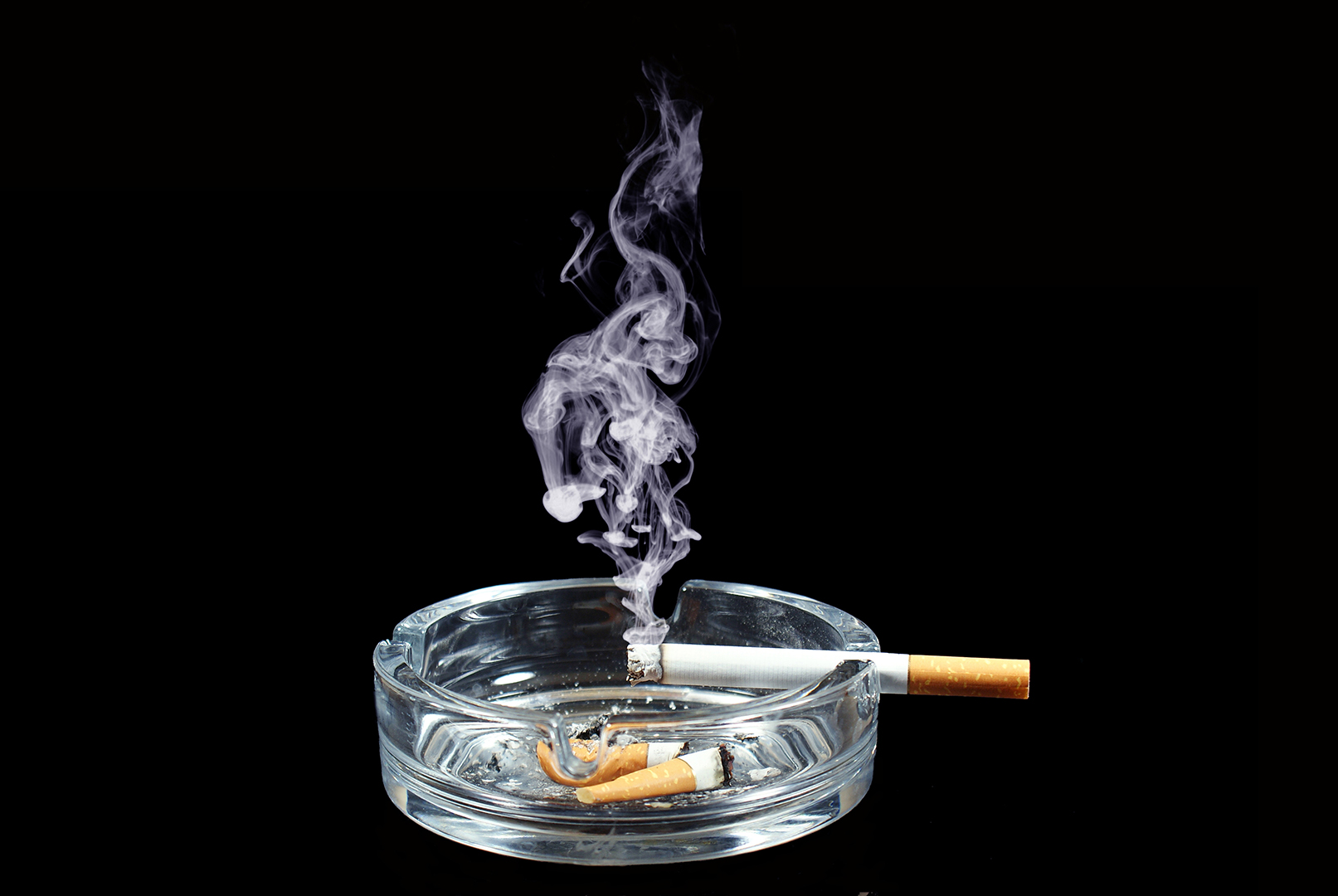 Cigarette in an ash tray.