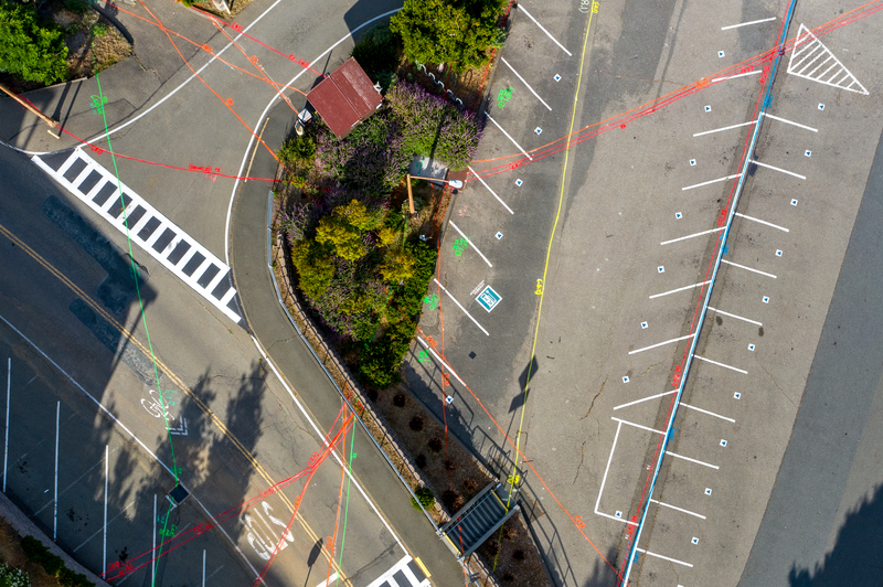 Aerial view of the various underground utility lines marked by red, yellow, and green lines.