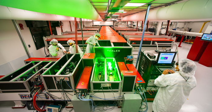 BELLA, the Berkeley Laboratory Laser Accelerator emitting a glowing green light.