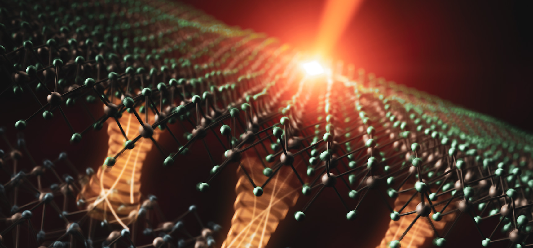Artistic depiction of electron transfer driven by an ultrashort laser pulse, across an interface between two atomically-thin materials.