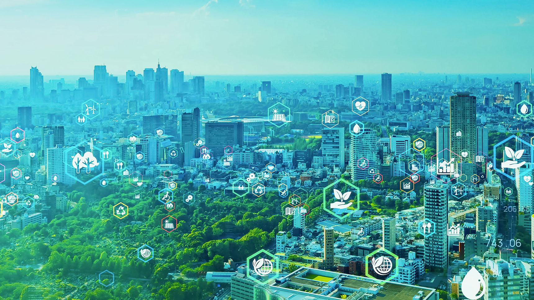 Environmental technology concept image. Various environmentally focused icons are placed overtop of a green and blue tinted city-scape.