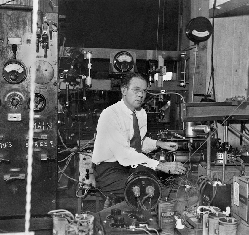 Ernest Orlando Lawrence Lawrence sitting at the control table of the 27-inch cyclotron.