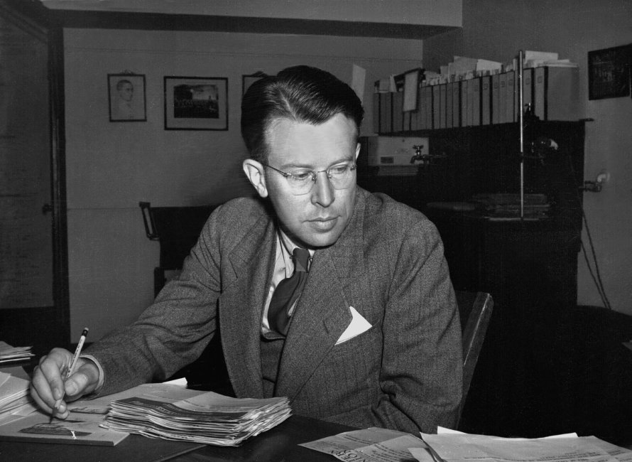 Ernest Lawrence at a desk.