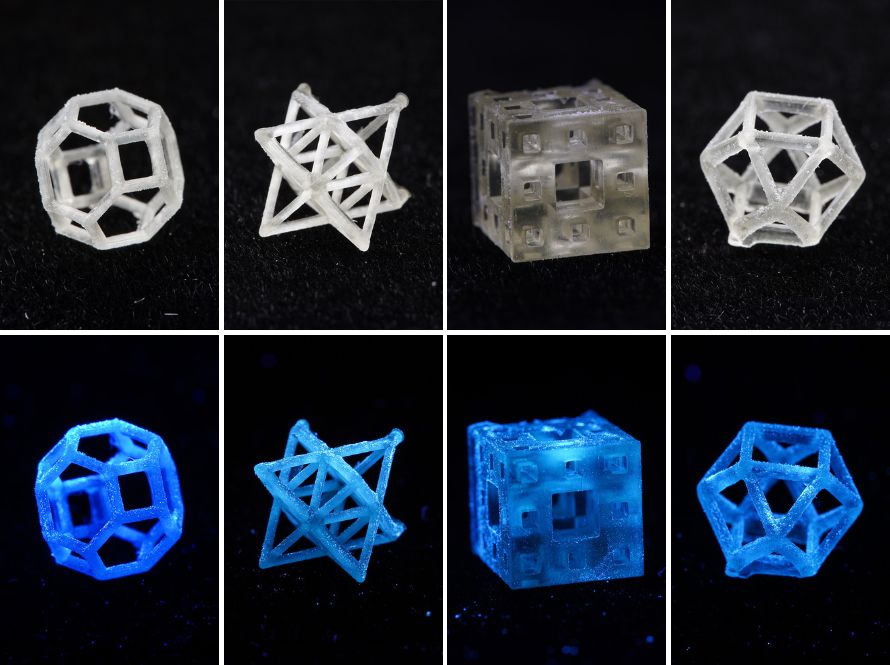 Eight 2-centimeter-tall 3D-printed devices fabricated from supramolecular ink that emits blue or white light.