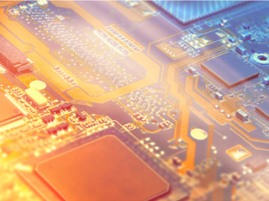 Close-up of an electronic circuit board with circuitry and microchip details with golden and blue color tones.