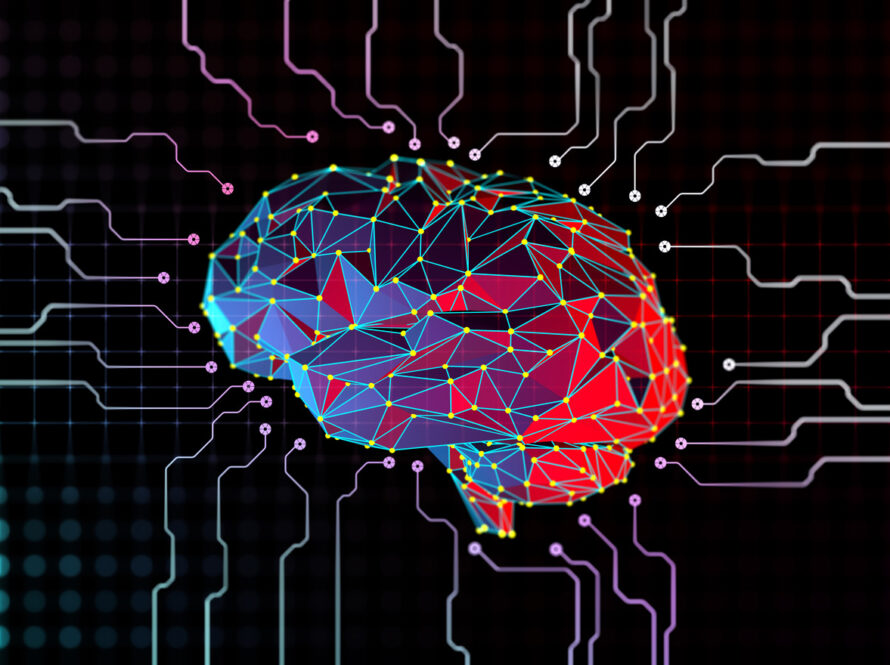 Digital illustration of a multicolored polygonal human brain connected to circuit lines on a dark background.