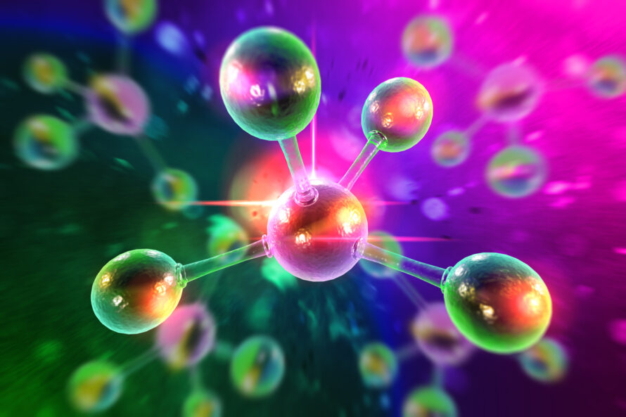 Close up of colorful atomic particles.