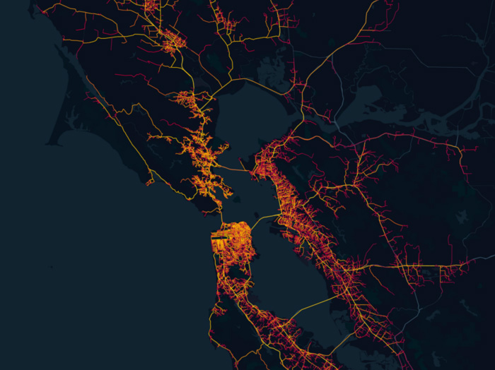 Map of the SF Bay Area with yellow and orange lines running through the region, simulating the movement of the population through a region's road networks.