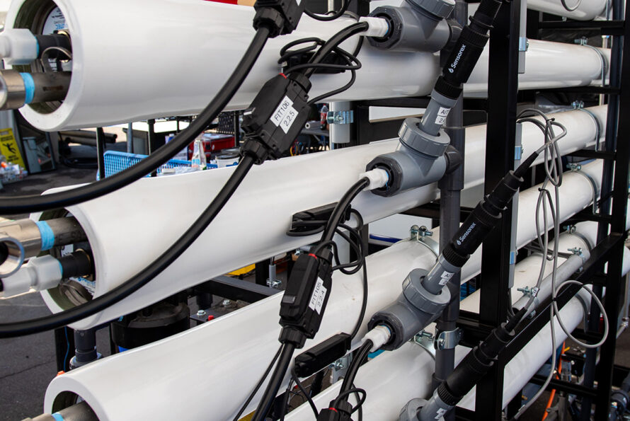 White pipes with various tubes and wires.