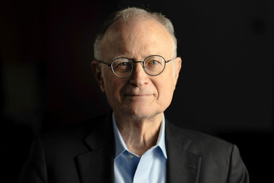 Michael Witherell in front of a dark background.