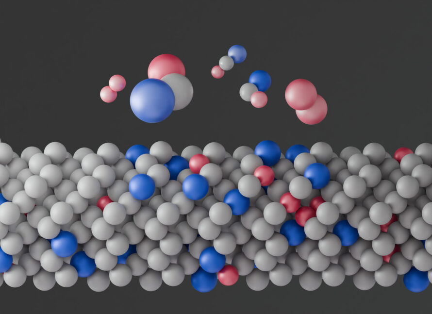 An illustration showing a layer of closely packed spheres, mostly gray, with a few blue and red ones mixed in. Floating above the layer are several small clusters of spheres in different arrangements of the blue, red, and gray.