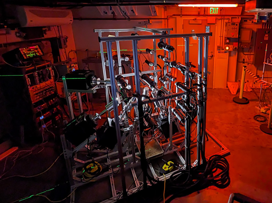 Metal scientific instruments against a red backlit background