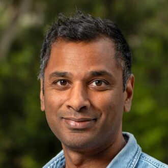 Person wearing blue collared shirt
