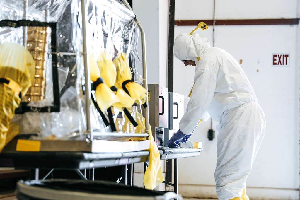 Person in scrubs with scientific equipment